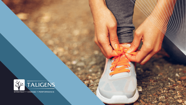 Close-up of someone lacing up a running shoe
