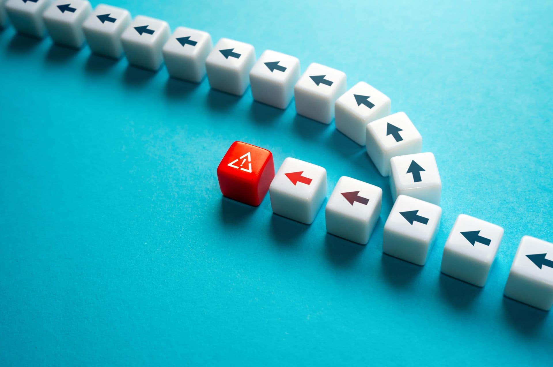 A curving row of dice with arrows, one red die leading a new direction