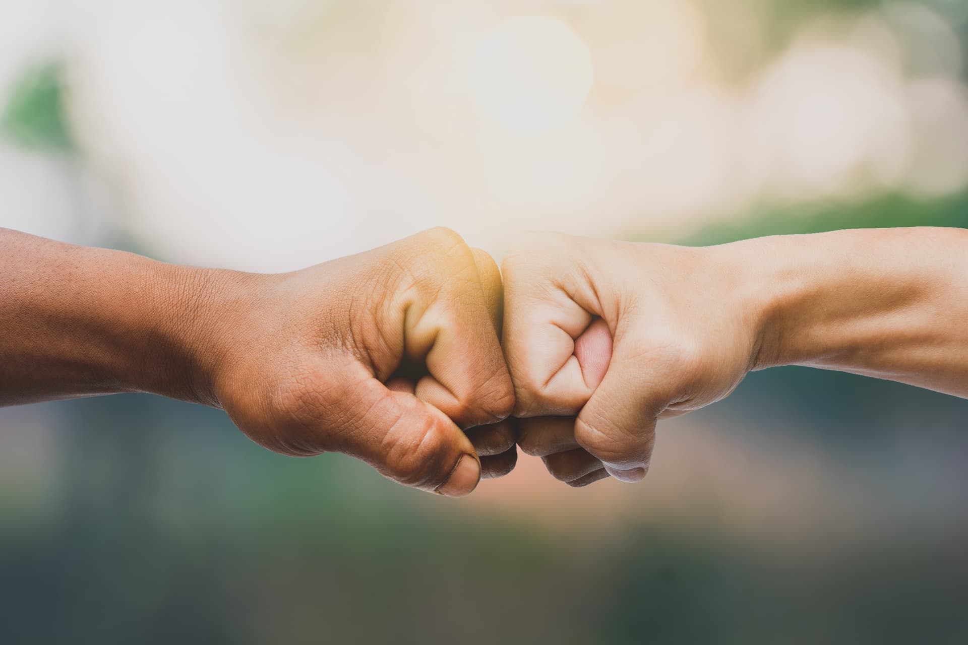 Two colleagues sharing a fist bump