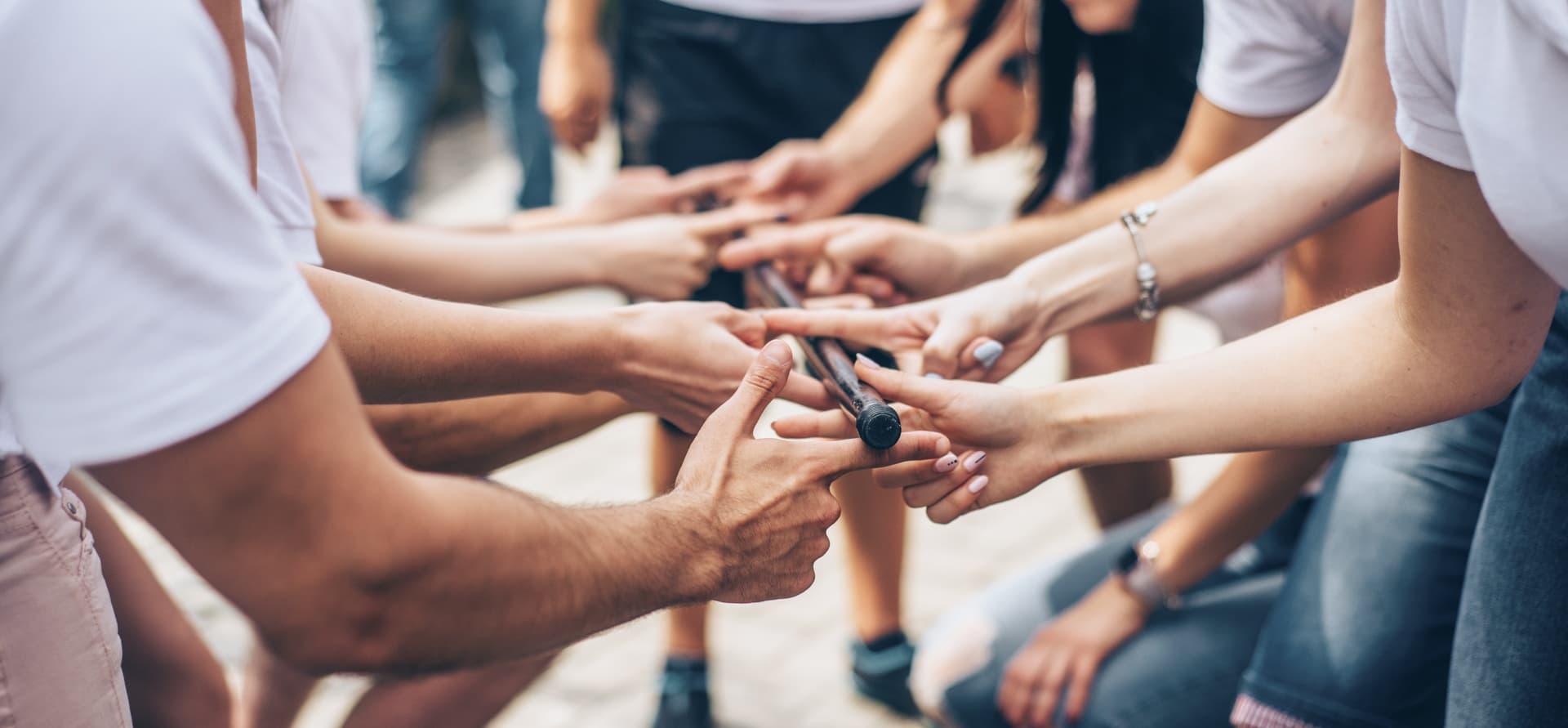 Hands joined together at the center of a circle